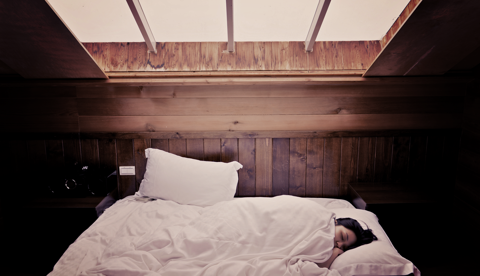 girl wakes up without alarm due to sun pouring in window