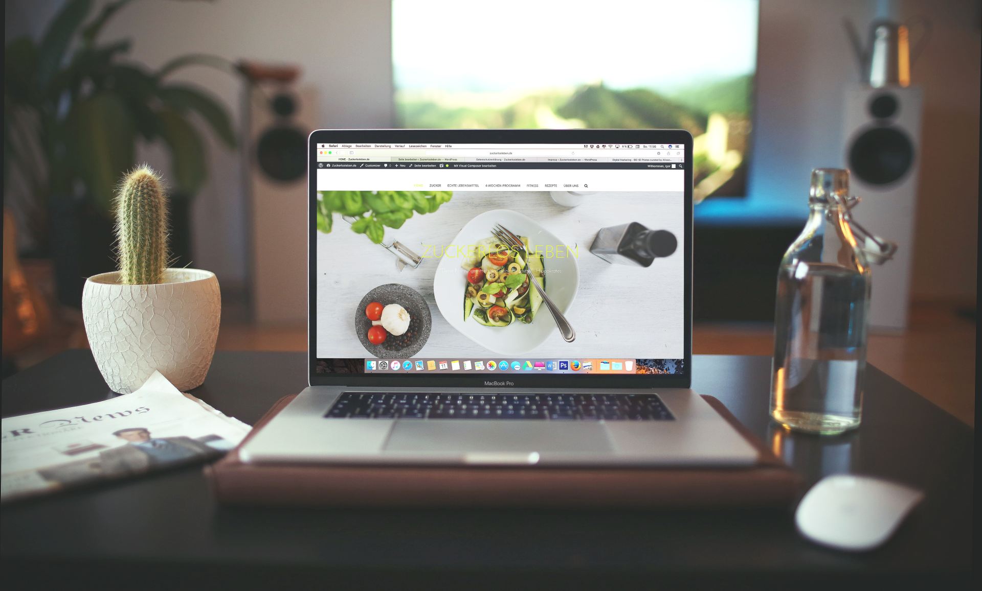 computer open on table with breakfast .com