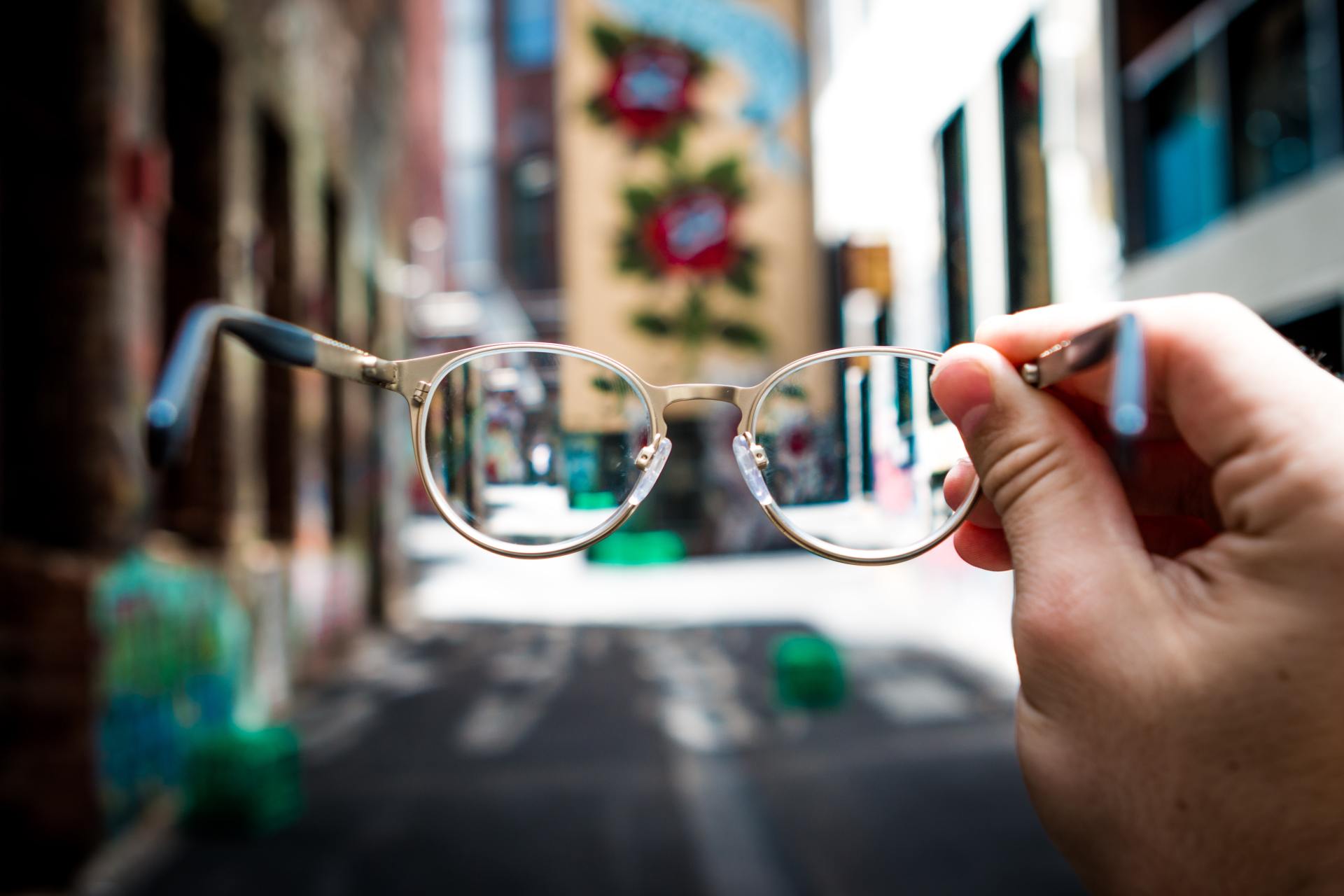 glasses being held out