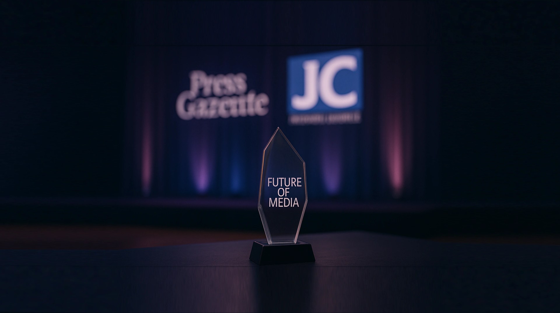 A sleek, glass award reading "Future of Media" sits on top of a table. Press Gazette and The Jewish Chronicle logos glow in the background.