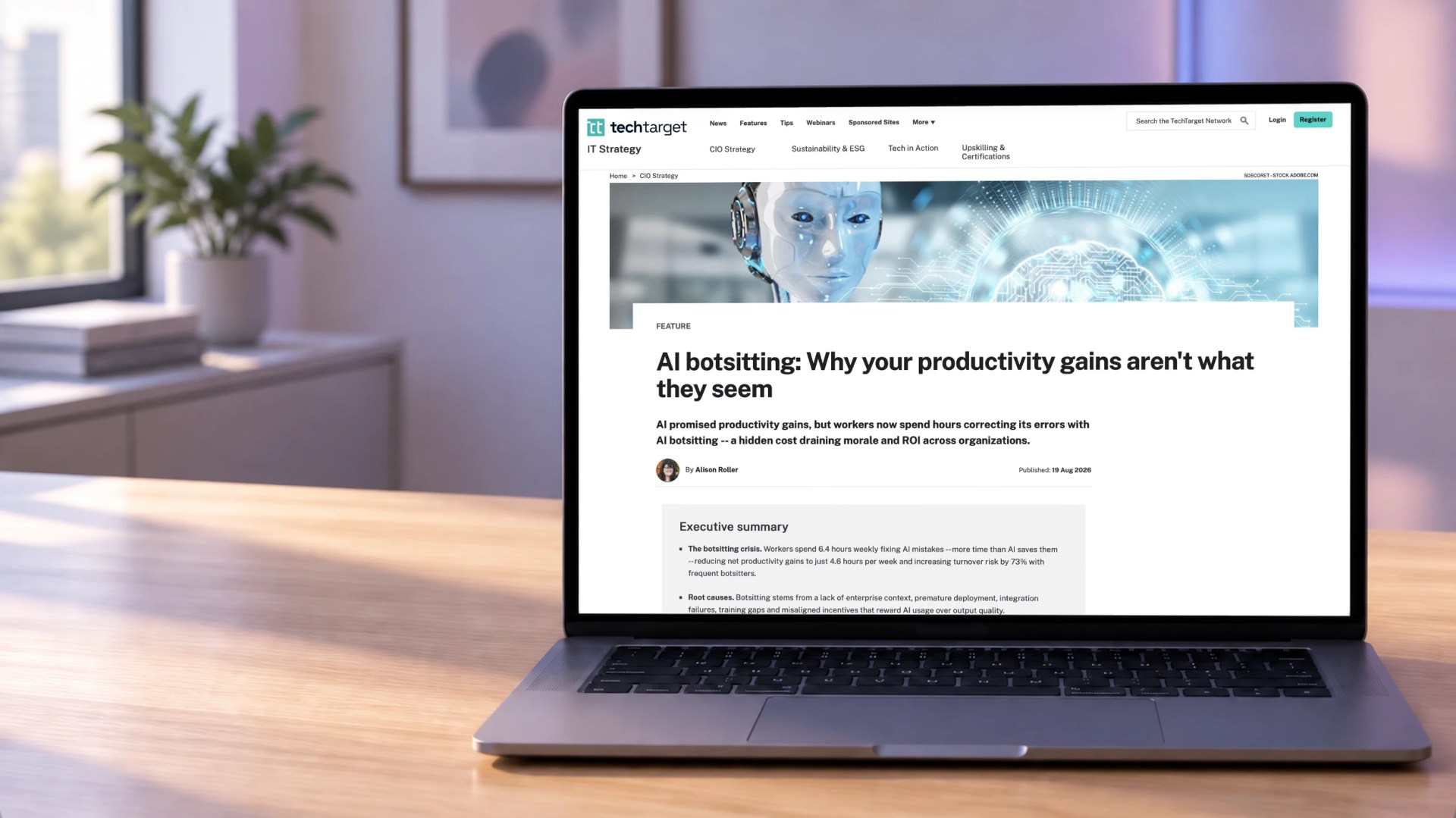 A laptop sits open on a desk, showing an article from TechTarget on AI botsitting.