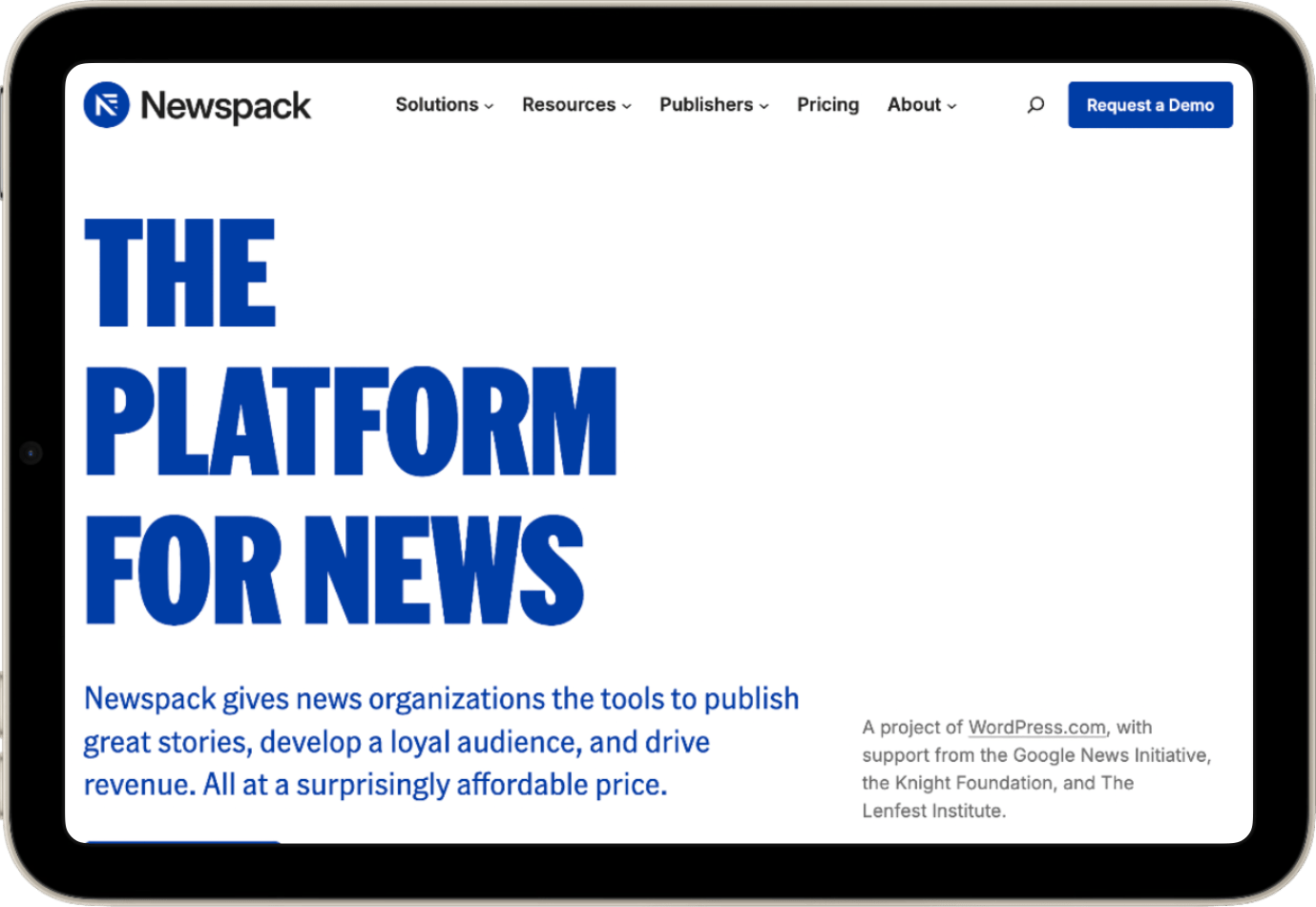 The Newspack website homescreen, displaying "THE PLATFORM FOR NEWS" inside of an iPad Mini.