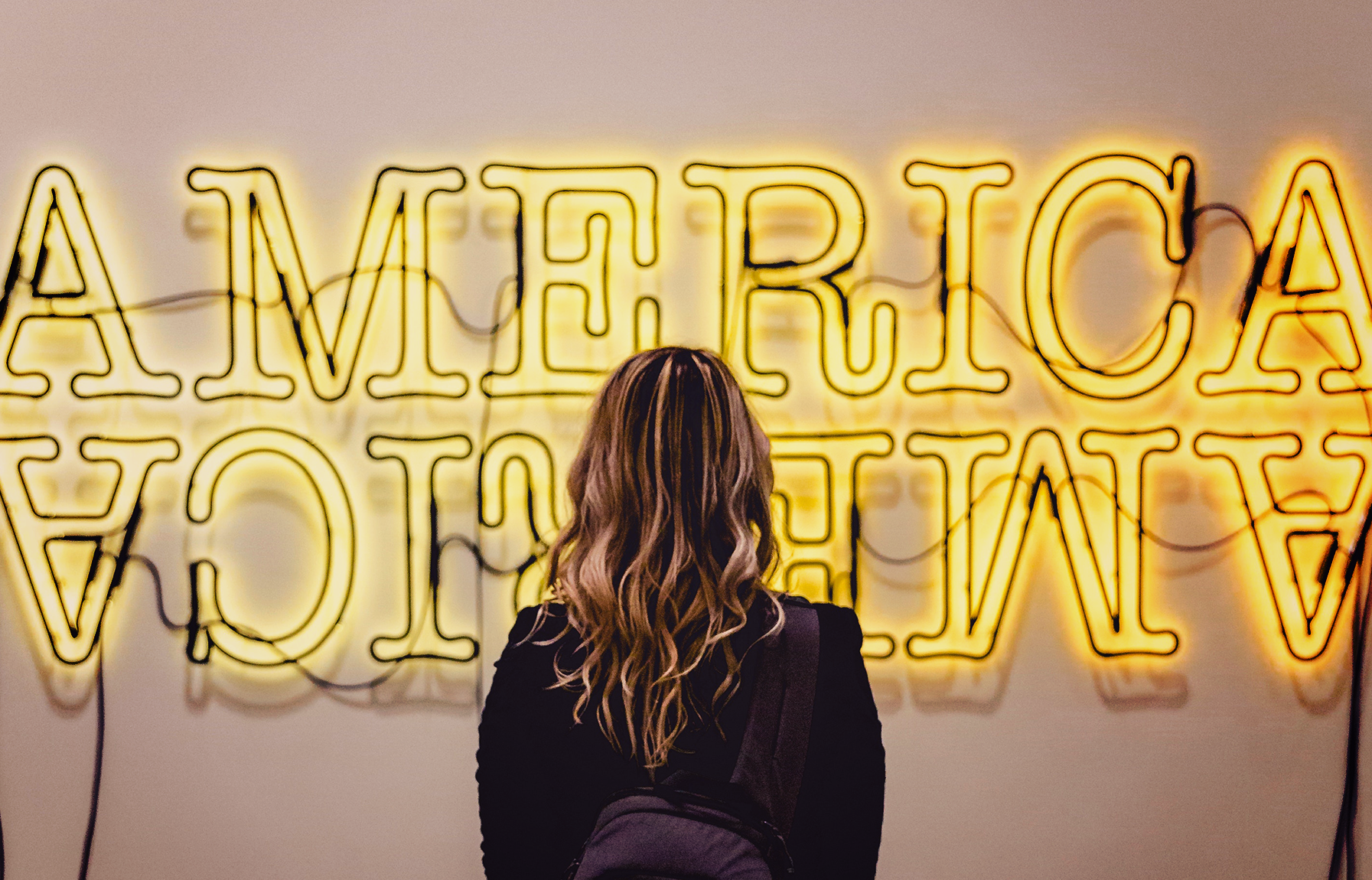 gen z woman admiring sign